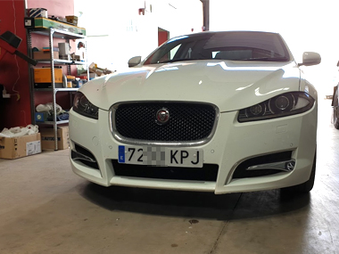 Jaguar XF Coupe with new plates fitted at our workshop Jaguar XF Coupe in workshop